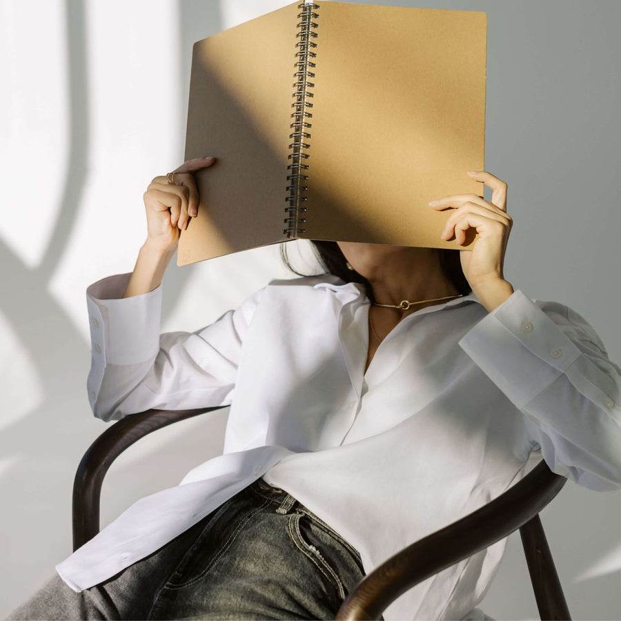 notebook covering ladies face privacy